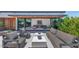 Relaxing outdoor seating area with seamless indoor-outdoor connection, complemented by mature greenery at 5812 N 44Th Pl, Phoenix, AZ 85018