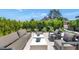 Outdoor patio space with comfortable seating and lush landscaping; Camelback Mountain in the distance at 5812 N 44Th Pl, Phoenix, AZ 85018