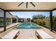 Relaxing backyard oasis featuring a pool, manicured lawn, lounge chairs, and covered patio at 5812 N 44Th Pl, Phoenix, AZ 85018