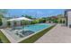 Stunning pool area featuring unique loungers, lush green turf, and manicured landscaping at 5812 N 44Th Pl, Phoenix, AZ 85018