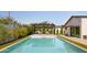 A modern pool with a pergola covered lounge area and a well-manicured lawn and landscape at 5812 N 44Th Pl, Phoenix, AZ 85018