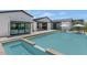 Expansive backyard with a stunning pool, modern patio, and manicured landscaping at 5812 N 44Th Pl, Phoenix, AZ 85018