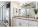 Functional bathroom featuring a granite countertop, modern fixtures, and a convenient washer-dryer setup at 5995 N 78Th St # 2079, Scottsdale, AZ 85250