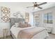 Bright bedroom with a comfortable bed, decorative headboard, and ample natural light from the windows at 5995 N 78Th St # 2079, Scottsdale, AZ 85250