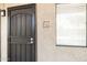 Apartment front door with black metal security gate and large, bright window at 5995 N 78Th St # 2079, Scottsdale, AZ 85250