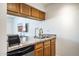 Kitchen with stainless appliances, wood cabinets and granite countertops at 5995 N 78Th St # 2079, Scottsdale, AZ 85250