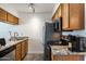 Kitchen features stainless steel appliances, granite counters and wood cabinets at 5995 N 78Th St # 2079, Scottsdale, AZ 85250