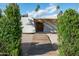 Inviting front entrance featuring a wooden walkway leading to a rustic wood door and desert landscaping at 6740 E Presidio Rd, Scottsdale, AZ 85254