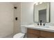 Modern bathroom features a tiled shower, hexagon tile floor, updated vanity, and sleek black fixtures at 6841 E Osborn Rd # C, Scottsdale, AZ 85251
