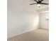 This carpeted bedroom is bright and airy with a modern ceiling fan and ample space at 6841 E Osborn Rd # C, Scottsdale, AZ 85251
