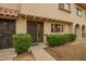 Charming townhouse with a welcoming front entrance and manicured shrubbery at 6841 E Osborn Rd # C, Scottsdale, AZ 85251