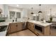 Bright kitchen featuring stainless appliances, modern white cabinets, and a stylish countertop island with pendant lighting at 6841 E Osborn Rd # C, Scottsdale, AZ 85251