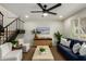 Comfortable living room featuring a blue sofa, contemporary furniture, and a decorative painting at 6841 E Osborn Rd # C, Scottsdale, AZ 85251