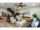 Stylish living room with modern furniture, a staircase, and ample natural light at 6841 E Osborn Rd # C, Scottsdale, AZ 85251
