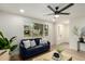 Inviting living room featuring a comfortable sofa, bright lighting, and modern decor at 6841 E Osborn Rd # C, Scottsdale, AZ 85251