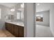 Bathroom boasts dual sinks, spacious countertop, and a large mirror at 7681 W Meadowlark Way, Florence, AZ 85132