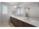 Bathroom boasts dual sinks, spacious countertop, and a large mirror at 7681 W Meadowlark Way, Florence, AZ 85132