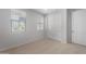 Bright bedroom with neutral carpet, window with blinds, and a closet with sliding doors at 7681 W Meadowlark Way, Florence, AZ 85132