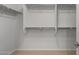 Walk-in closet with shelves and rods for organized storage at 7681 W Meadowlark Way, Florence, AZ 85132