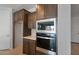Close-up of a modern kitchen with stainless steel appliances and dark cabinetry, ready for cooking at 7681 W Meadowlark Way, Florence, AZ 85132