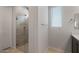 Modern bathroom showcasing a glass-enclosed shower with tiled walls and floor at 7681 W Meadowlark Way, Florence, AZ 85132