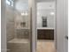 Modern shower featuring glass enclosure and tiled bench at 7681 W Meadowlark Way, Florence, AZ 85132