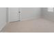 Light-filled bedroom features neutral carpet, a window, and a white door at 7723 W Cactus Wren Way, Florence, AZ 85132