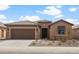 Charming single-story home featuring a well-manicured landscape, neutral stucco, and a cozy entrance at 7723 W Cactus Wren Way, Florence, AZ 85132