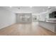 Expansive open-concept living room featuring wood-look floors, ample windows, and recessed lighting at 7723 W Cactus Wren Way, Florence, AZ 85132