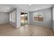 Bright living room with wood floors and large windows showcasing the backyard at 7723 W Cactus Wren Way, Florence, AZ 85132