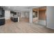 Open concept living room featuring wood floors, large windows, and backyard access at 7723 W Cactus Wren Way, Florence, AZ 85132
