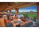 Comfortable outdoor patio seating area with scenic views of the landscaped grounds and surrounding landscape at 7723 W Cactus Wren Way, Florence, AZ 85132