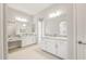 Spacious bathroom with double sinks, granite countertops, tile floor, and white cabinets at 7836 W Mockingbird Way, Florence, AZ 85132
