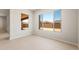 Bright bedroom with tile floors and great natural light with large window overlooking backyard at 7836 W Mockingbird Way, Florence, AZ 85132