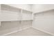 Walk-in closet provides ample storage space with shelving and carpet flooring at 7836 W Mockingbird Way, Florence, AZ 85132