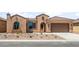 Charming single-story home featuring desert landscaping, a tile roof, and a welcoming front entrance at 7836 W Mockingbird Way, Florence, AZ 85132