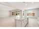 Open concept kitchen with a granite island, stainless steel appliances, and lots of natural light at 7836 W Mockingbird Way, Florence, AZ 85132