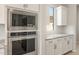 Gourmet kitchen with stainless steel appliances, granite countertops, and custom cabinetry at 7836 W Mockingbird Way, Florence, AZ 85132