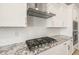 Modern kitchen details include granite countertops, stainless steel appliances and decorative backsplash at 7836 W Mockingbird Way, Florence, AZ 85132