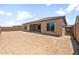 Backyard featuring a covered patio and ample space for outdoor activities and landscaping at 7870 W Mockingbird Way, Florence, AZ 85132