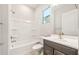 Bathroom featuring a shower-tub combo and vanity with dark wood cabinets and brushed gold hardware at 7870 W Mockingbird Way, Florence, AZ 85132