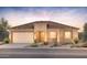 Charming single-story home with a stucco exterior, two-car garage, and desert landscaping at 7888 W Mockingbird Way, Florence, AZ 85132