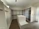 Spacious walk-in closet with custom shelving and hardwood floors at 8167 E Leaning Rock Rd # 193, Scottsdale, AZ 85266