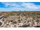 Desert landscape showcasing local greenery, a neighboring house, and views of distant mountains, perfect for building at 8167 E Leaning Rock Rd # 193, Scottsdale, AZ 85266