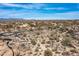 Desert land on a bright day, complemented by indigenous trees and views of custom homes at 8167 E Leaning Rock Rd # 193, Scottsdale, AZ 85266