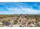 Beautiful desert landscape with homes nestled among the greenery, offering serene mountain views under a clear, blue sky at 8167 E Leaning Rock Rd # 193, Scottsdale, AZ 85266