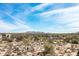 Vast desert landscape under a clear, blue sky, showcasing native vegetation and secluded homes in a serene setting with mountain views at 8167 E Leaning Rock Rd # 193, Scottsdale, AZ 85266