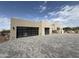 Modern home featuring a gray brick driveway and black framed garage doors at 8167 E Leaning Rock Rd # 193, Scottsdale, AZ 85266
