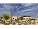 Stunning modern desert home featuring stone accents and native landscaping at 8167 E Leaning Rock Rd # 193, Scottsdale, AZ 85266