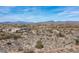 Broad aerial view of luxury homes nestled amongst the desert landscape, with mountain range in the background at 8395 E Leaning Rock Rd # 187, Scottsdale, AZ 85266